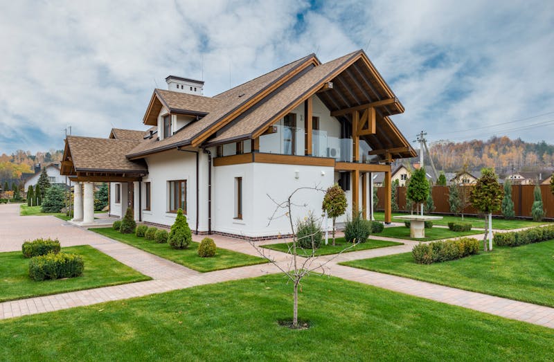 Modern house with beautiful landscaping and garden pathways